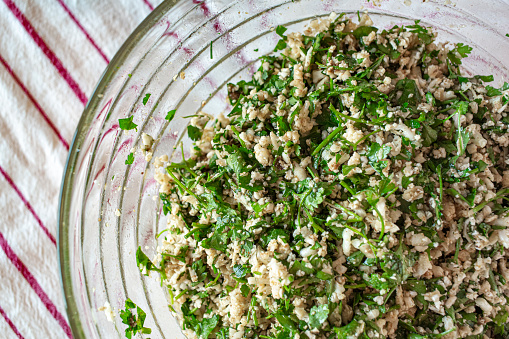 Cauliflower and parsley salad in a bowl.