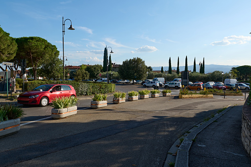 Reggello, Tuscany region, Italy. September 2023. A road with parked cars