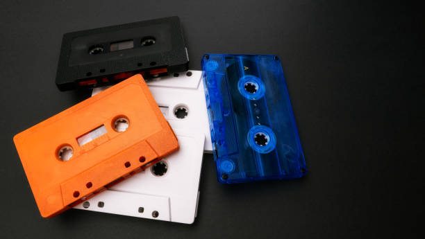 istock Four cassette tapes on black background. 1990s. 1731575805