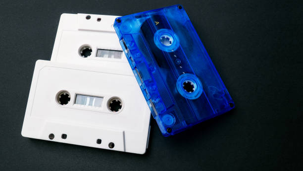 istock Three cassette tapes on black background. 1990s. 1731575884