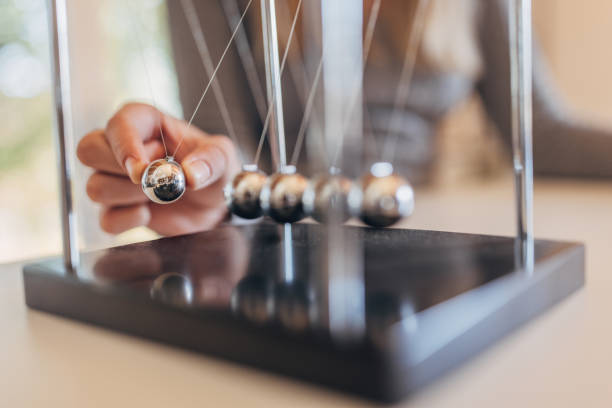 istock Newton's cradle businessman concept for cause and effect 1731576789