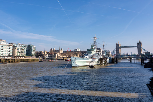 London, UK - 7th June 2017: HMS Belfast, a World War Two battleship, and Tower Bridge as seen from Southbank on the river Thames. London, UK.