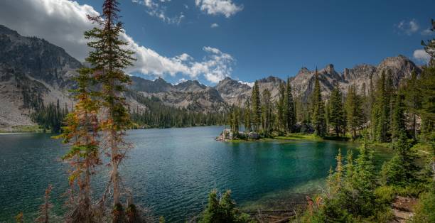 istock a large mountain range is in the distance behind some water 1731578801