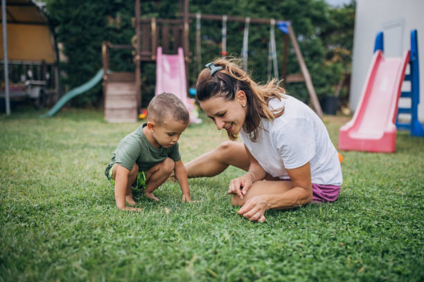 istock Mother and son playing in back yard 1731581362