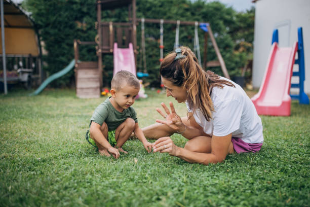 istock Mother and son playing in back yard 1731581759