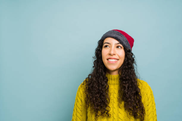 istock Young woman looking happy enjoying the fall weather 1731584591