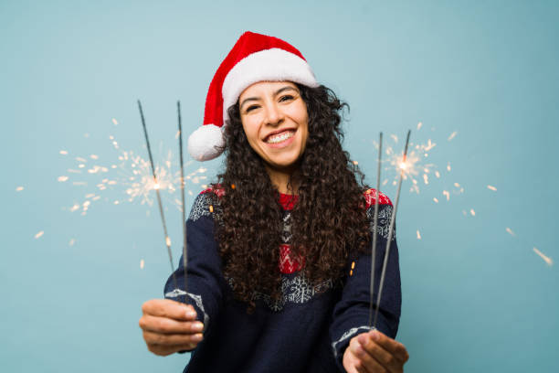 istock Excited woman using sparklers celebrating christmas 1731588813