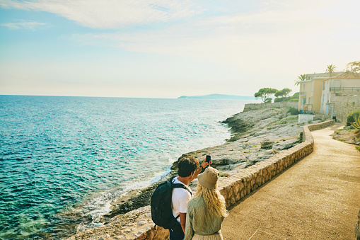 Young adult couple enjoying a hike along the coast of the Côte d'Azur in the south of France.