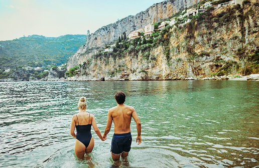 Young adult couple enjoying a swim along the coast of the Côte d'Azur in the south of France.