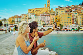 Young millennial couple enjoying their trip to Menton, while travelling in the south of France.
