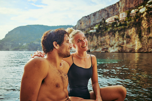 Young adult couple enjoying a swim along the coast of the Côte d'Azur in the south of France.