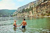 Young adult couple enjoying a swim along the coast of the Côte d'Azur in the south of France.