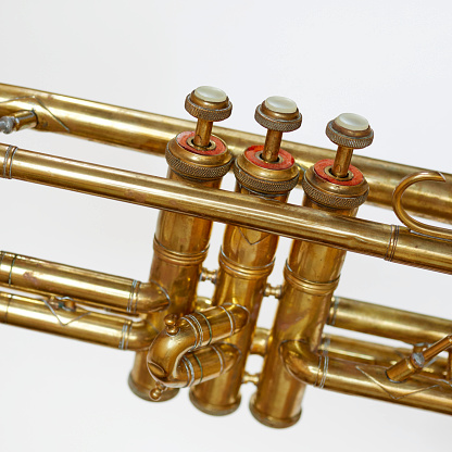 Photograph of a brass horn and music.