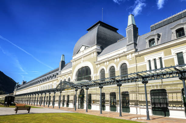 Canfranc international station, located in Canfranc, Spain, is a historic railway station. Canfranc Station, Spain, is a historic railway station known for its grandeur and architectural beauty. With its ornate facade and sprawling size, it stands as a symbol of a bygone era of luxury and cross-border travel. canfranc international railway station spain stock pictures, royalty-free photos & images