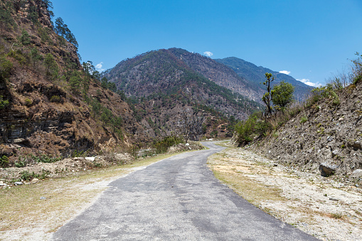 Asphalt road through the mountains in Eastern Bhutan, Asia