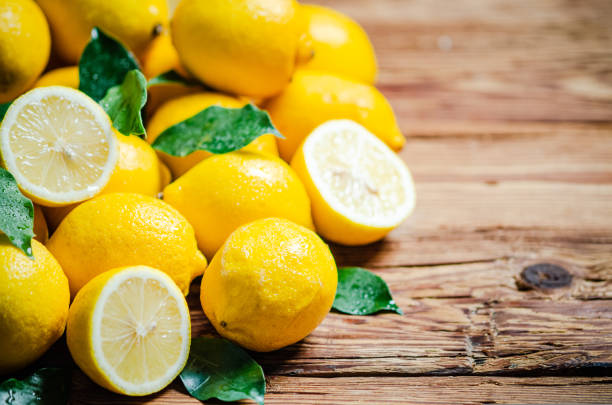 istock Fresh lemons. On wooden table. 1731644795