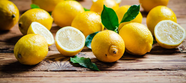 istock Fresh lemons. On wooden table. 1731648541