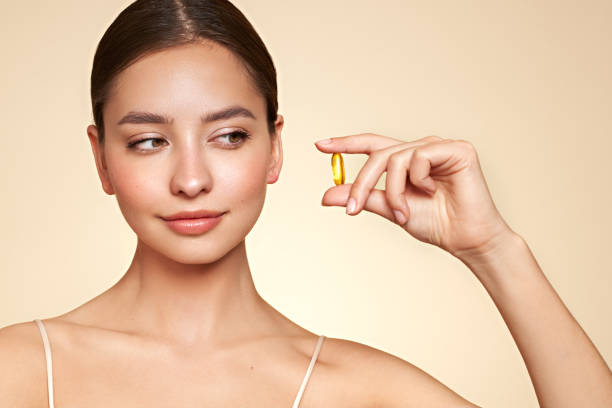 istock Beautiful Girl With Pill With Cod Liver Oil Omega-3 1731649643