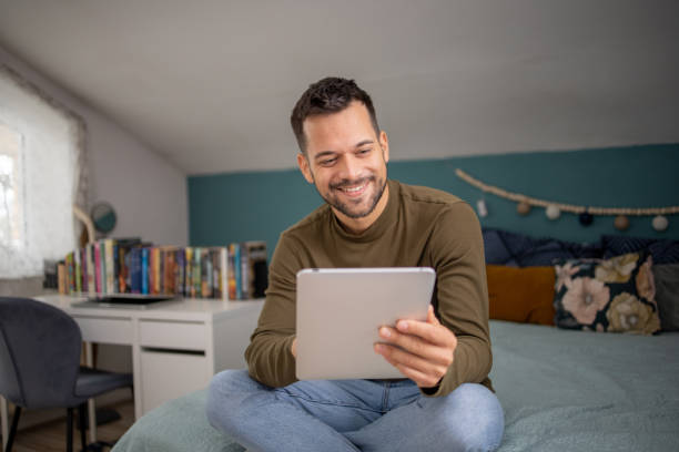 istock Young man with a digital tablet at home 1731660681