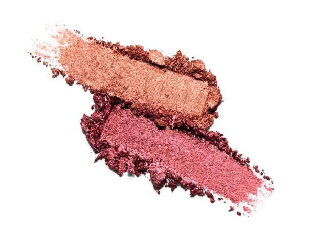 istock Red and bronze shimmering eye shadow texture swipe isolated on white background. Cosmetic product brush swatch 1731663540