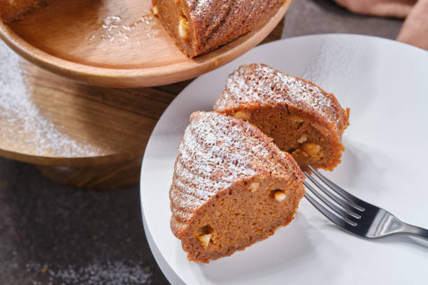 istock Sliced Muffin cake decorated icing sugar on the plate 1731684390