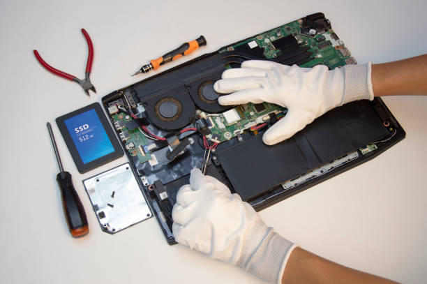 istock Top view. Technician repairing notebook computer, repairing motherboard and circuit. 1731693534