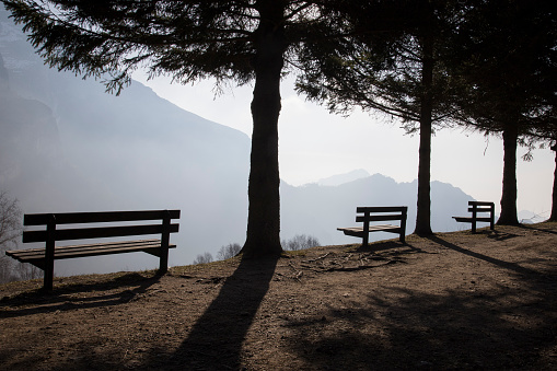 Some benches towards the mountain in silhouette.