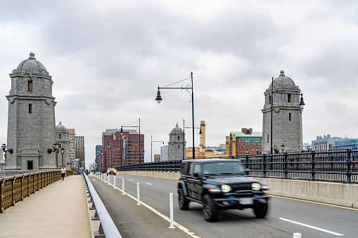 Craigie Bridge (Charles River Dam Bridge) in Boston, Massachusetts, USA.  There are pedestrians on the bridge.