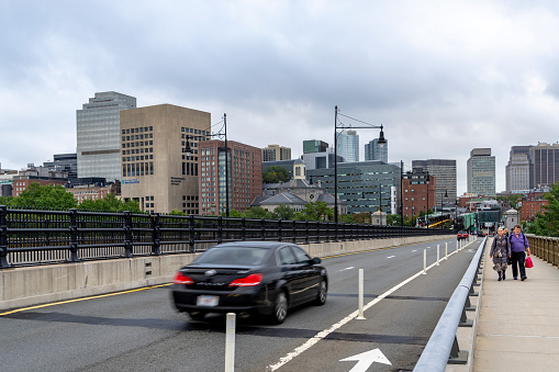 Craigie Bridge (Charles River Dam Bridge) in Boston, Massachusetts, USA.  There are pedestrians on the bridge.