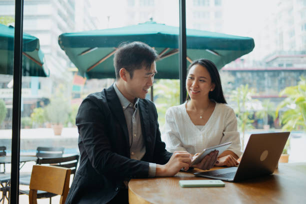 istock Insurance agent having discussion with client in cafe 1731764072