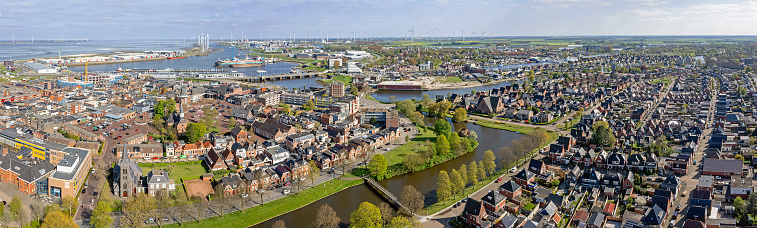 Aerial view Dutch residential area Delfzijl with harbor in the Netherlands