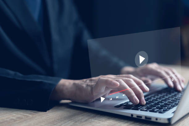 istock Live video content Online streaming marketing concept. Man's hands using laptop to stream online. Watch videos on the internet, live concerts, performances, or teaching. 1731780586