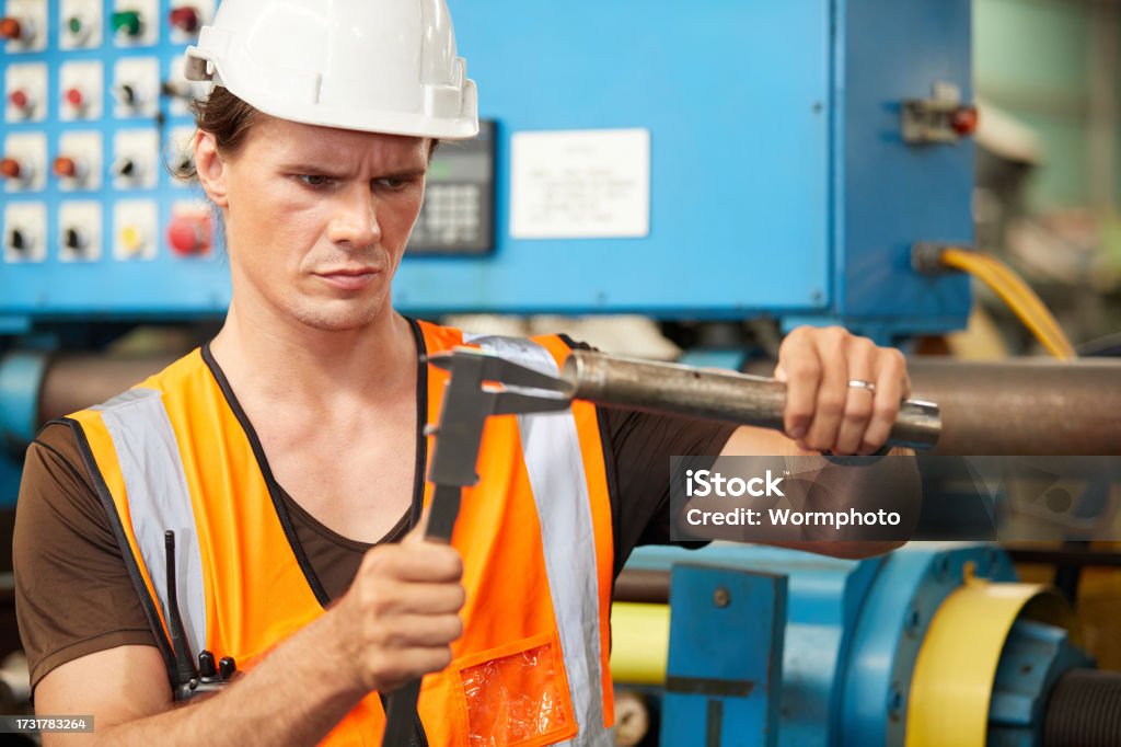 Worker Using Calipers Engineer Or Worker Using Calipers And Measuring A Steel Pipe In The ...