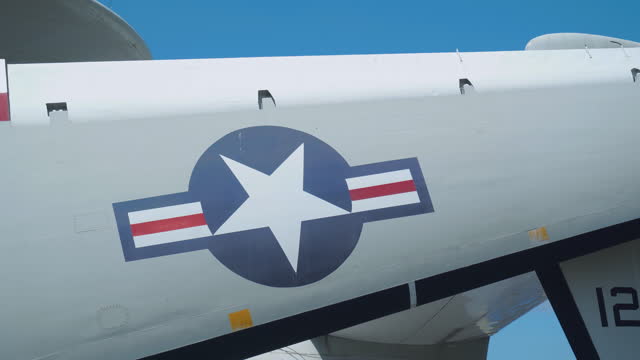 Close-up airplane wing with a painted star