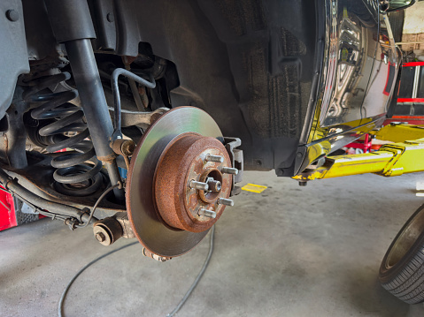 Close up car break disk in repair shop