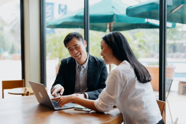 istock Insurance agent having discussion with client in cafe 1731803240