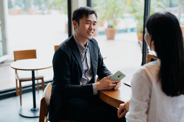 istock Business people having discussion in cafe 1731803447