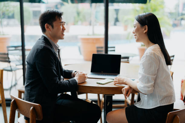 istock Insurance agent having discussion with client in cafe 1731803541