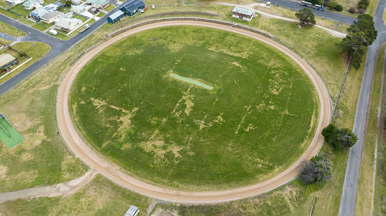 Drone aerial photograph of a large round sports field with an external dirt track in the township of Portland in The Central Tablelands of New South Wales in Australia