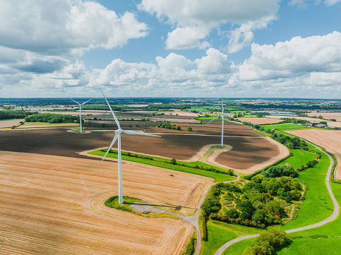 Drone view of Wind turbines in countryside fields, England