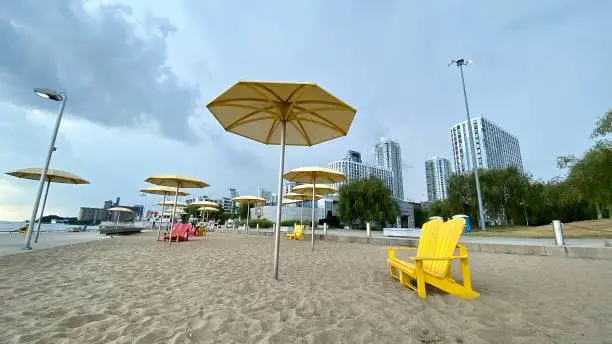 HTO Park is an urban beach in Toronto, Ontario, Canada. Long, beautiful beaches in summer. On a clear day, the breeze blows coolly. Various chairs in bright colors for relaxing.It is location west of Harbourfront Centre, on Lake Ontario.