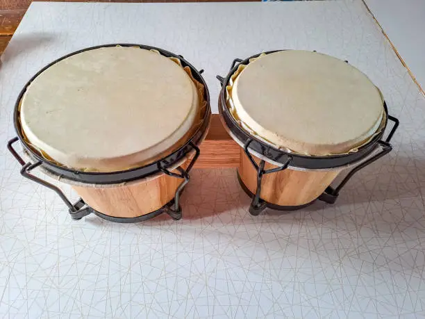 Photo of Set of Bongo Drums Isolated on a White Background. Latin percussion.