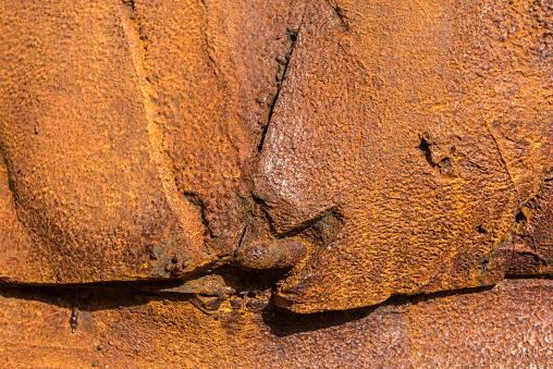 Machinery with rusty and deformed iron plates