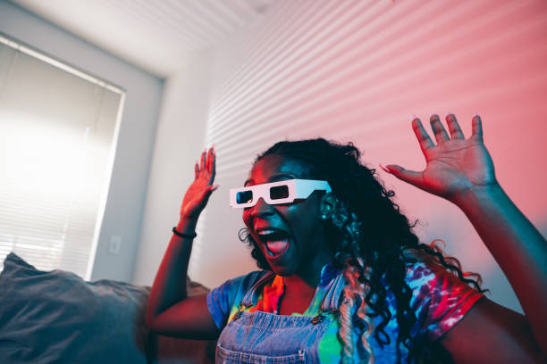 An old 3D glasses in the cinema on an orange surface