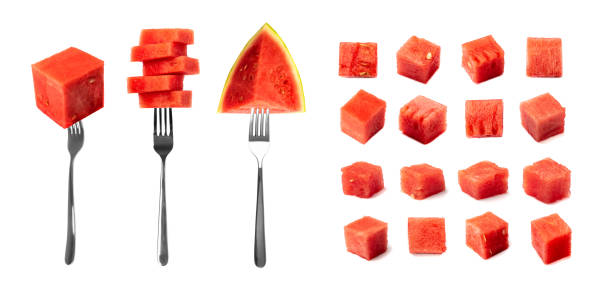 Watermelon on forks isolated. Water melon cuts, slice, cubes on fork set, square fruit piece, seedless watermelon on white background