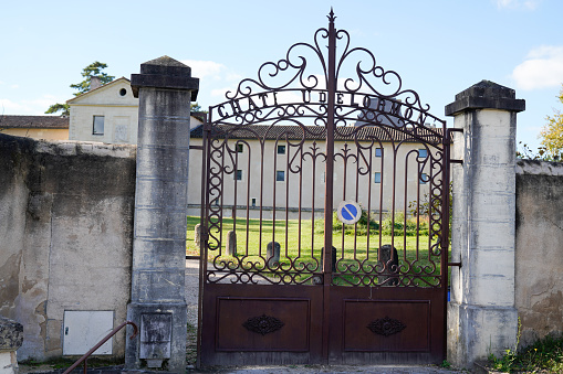 portal old brown rusty ancient classic metal home gate at entrance of classical vintage ancien house garden door in france europe