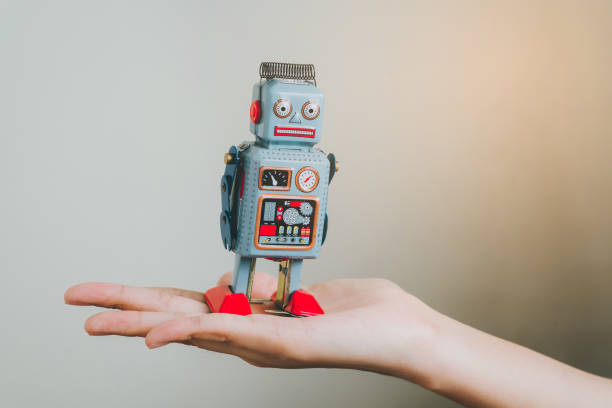 istock Hand hold vinatge robot, retro robot. 1731895622