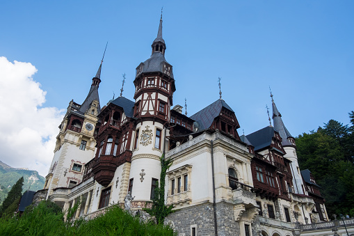 Sinaia, Romania - April 19, 2014: The Peles Castle, a Neo-Renaissance castle in the Carpathian Mountains, near Sinaia, Romania. It served as a royal summer retreat. It was built between 1873 and 1914. for King Carol I of Romania. Its inauguration was held in 1883.