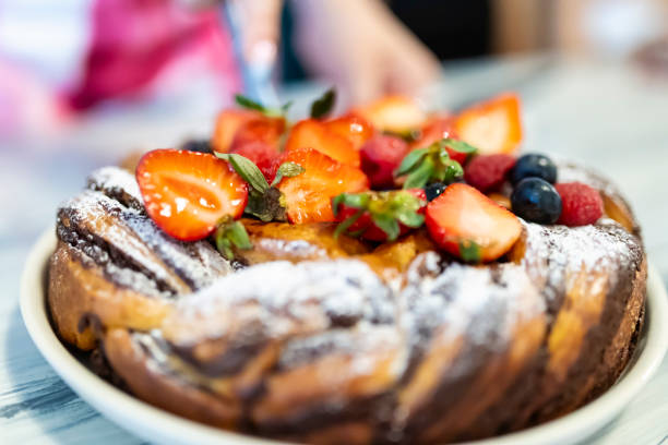 Chocolate babka with red berries as a birthday cake