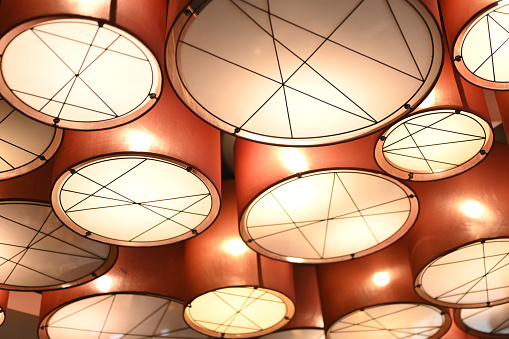 Low Angle View Of Illuminated Lamps On Ceiling
